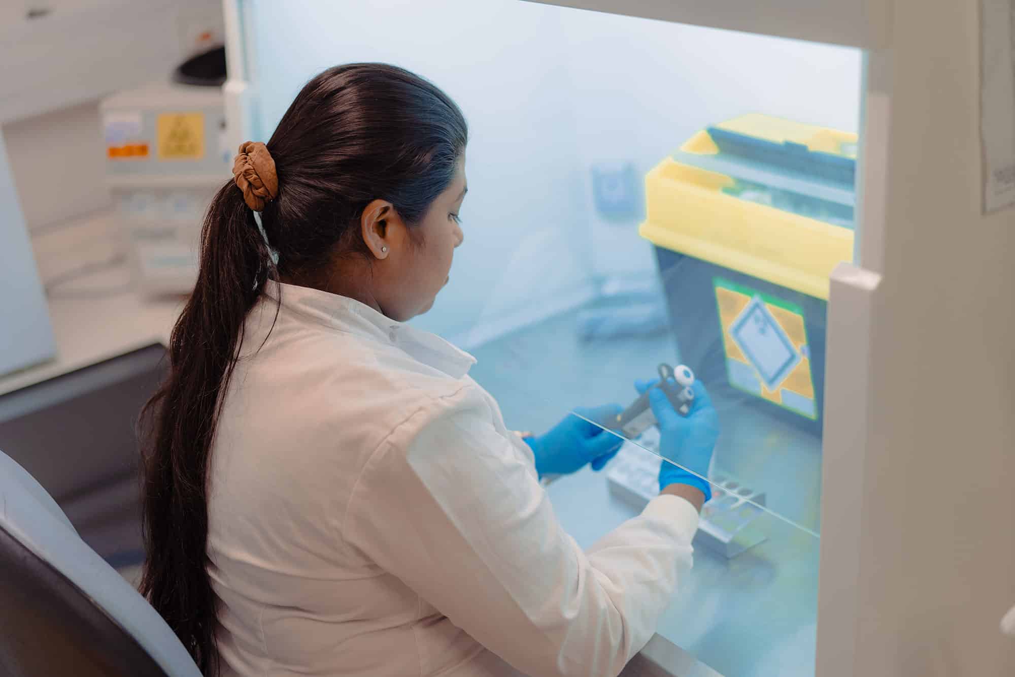 A scientist using equipment